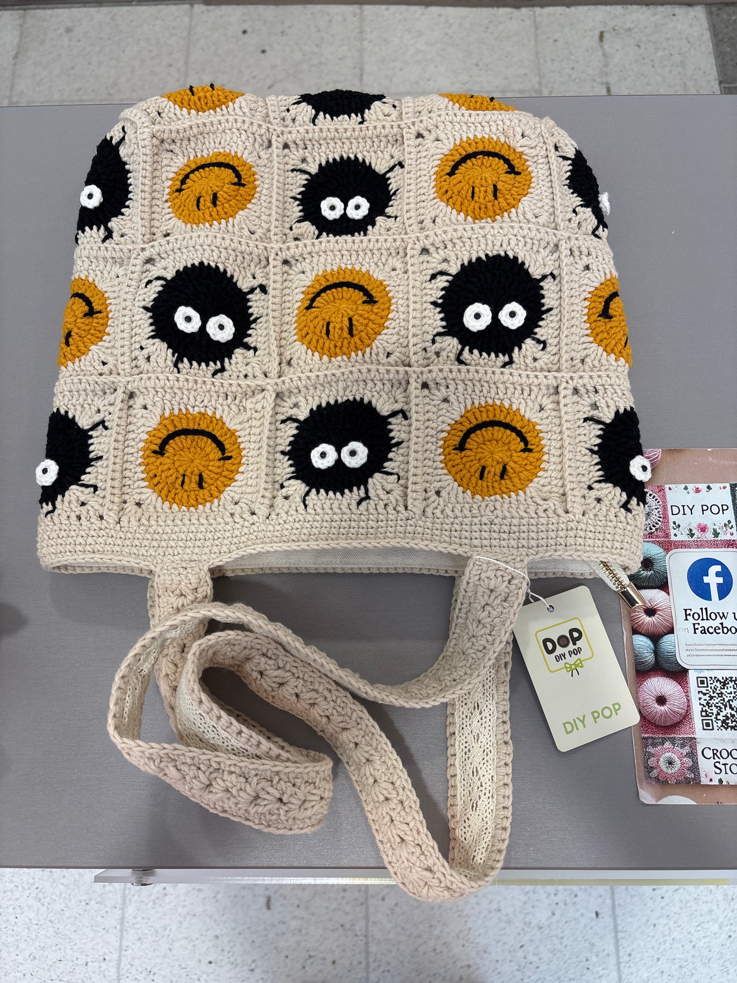 Handmade crochet bag with a charming smile pattern