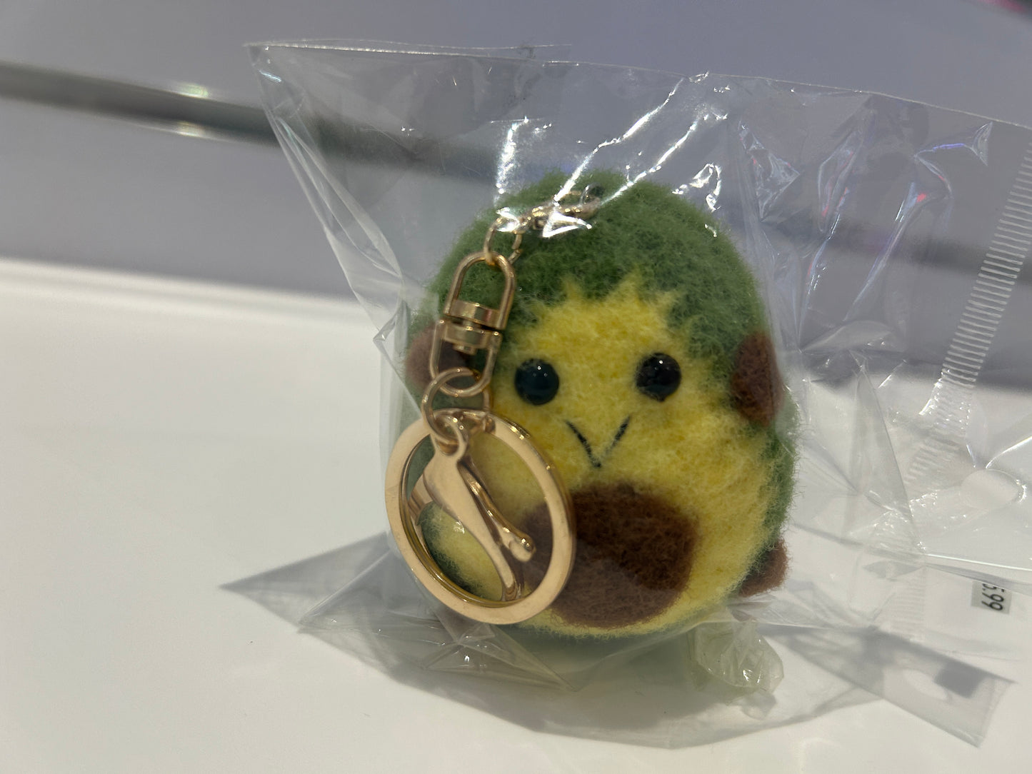 Handmade wool felt avocado keychain