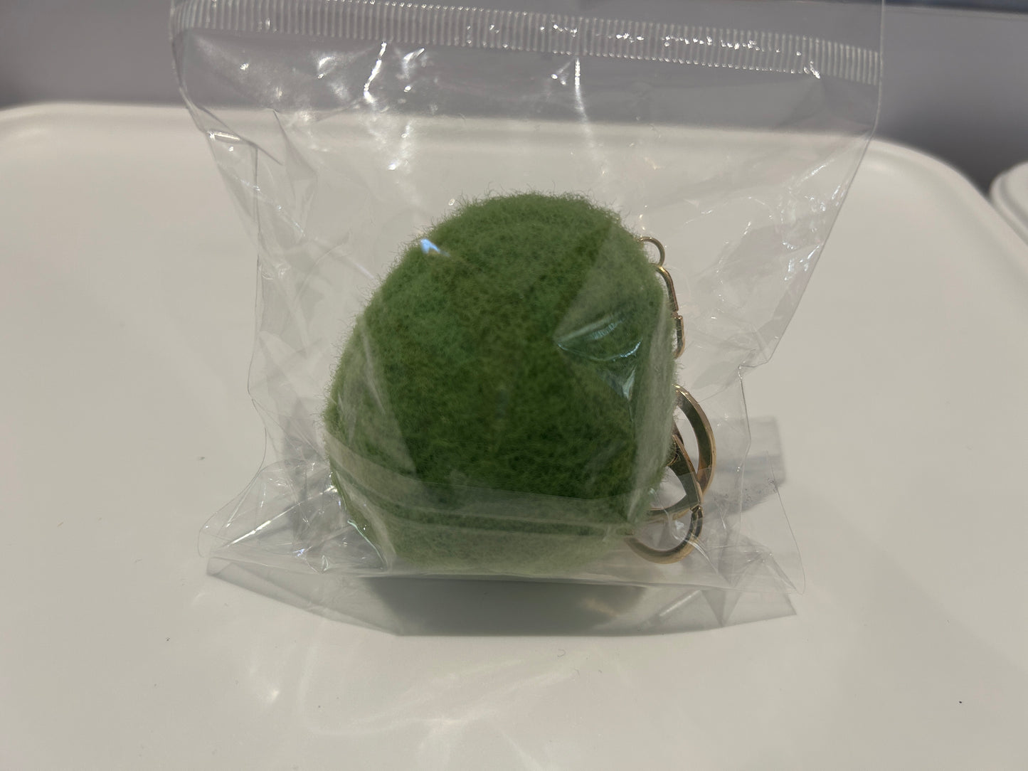 Handmade wool felt avocado keychain