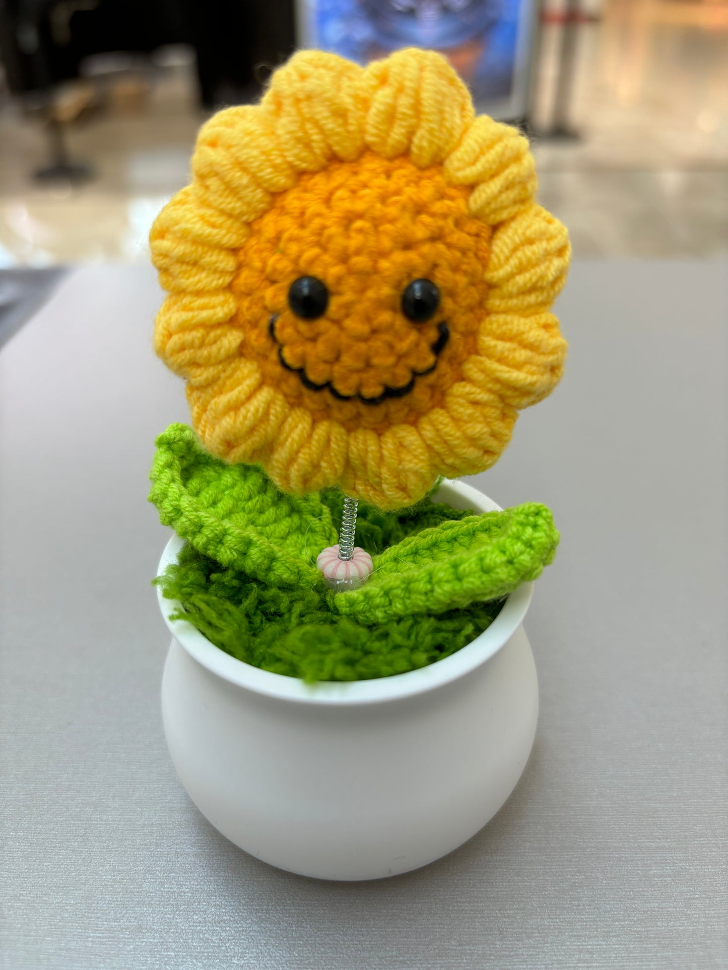 Hand-Crocheted Smiling Sunflower with Spring Stem in White Pot - Wobbling Flower Amigurumi Décor
