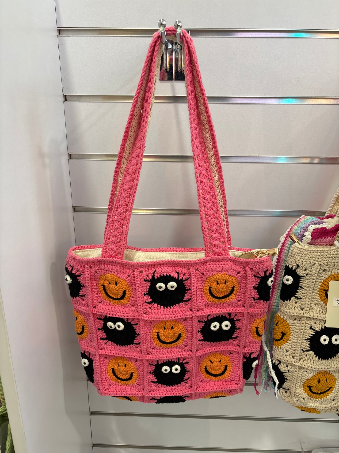 handmade crochet bag with a stylish smile face
