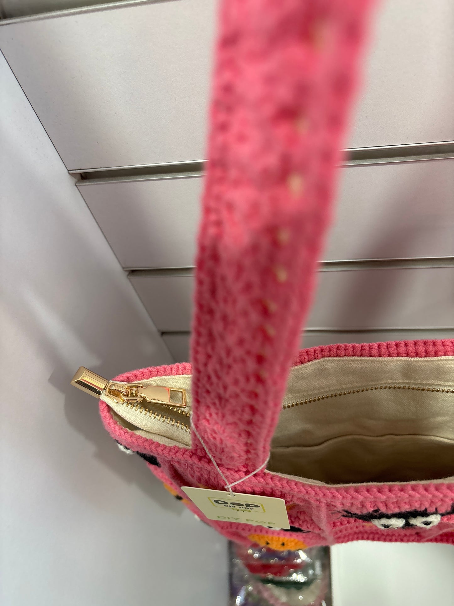 handmade crochet bag with a stylish smile face