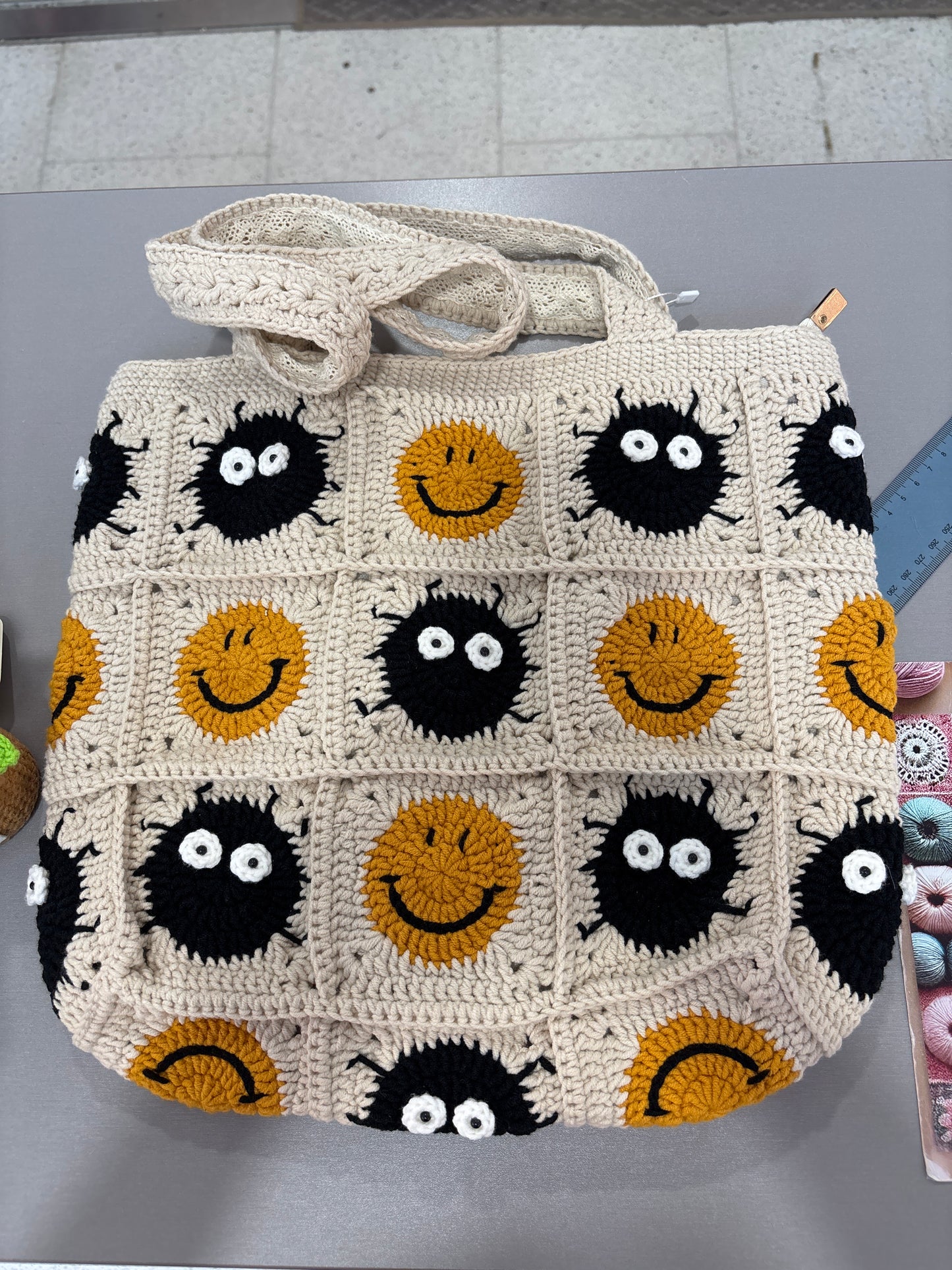 Handmade crochet bag with a charming smile pattern