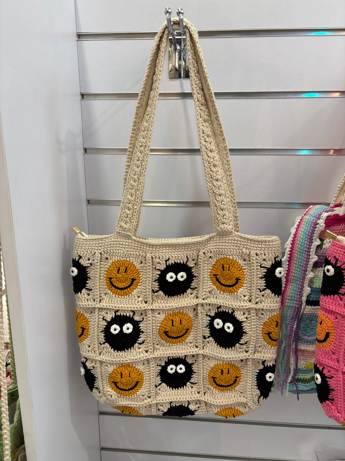 Handmade crochet bag with a charming smile pattern