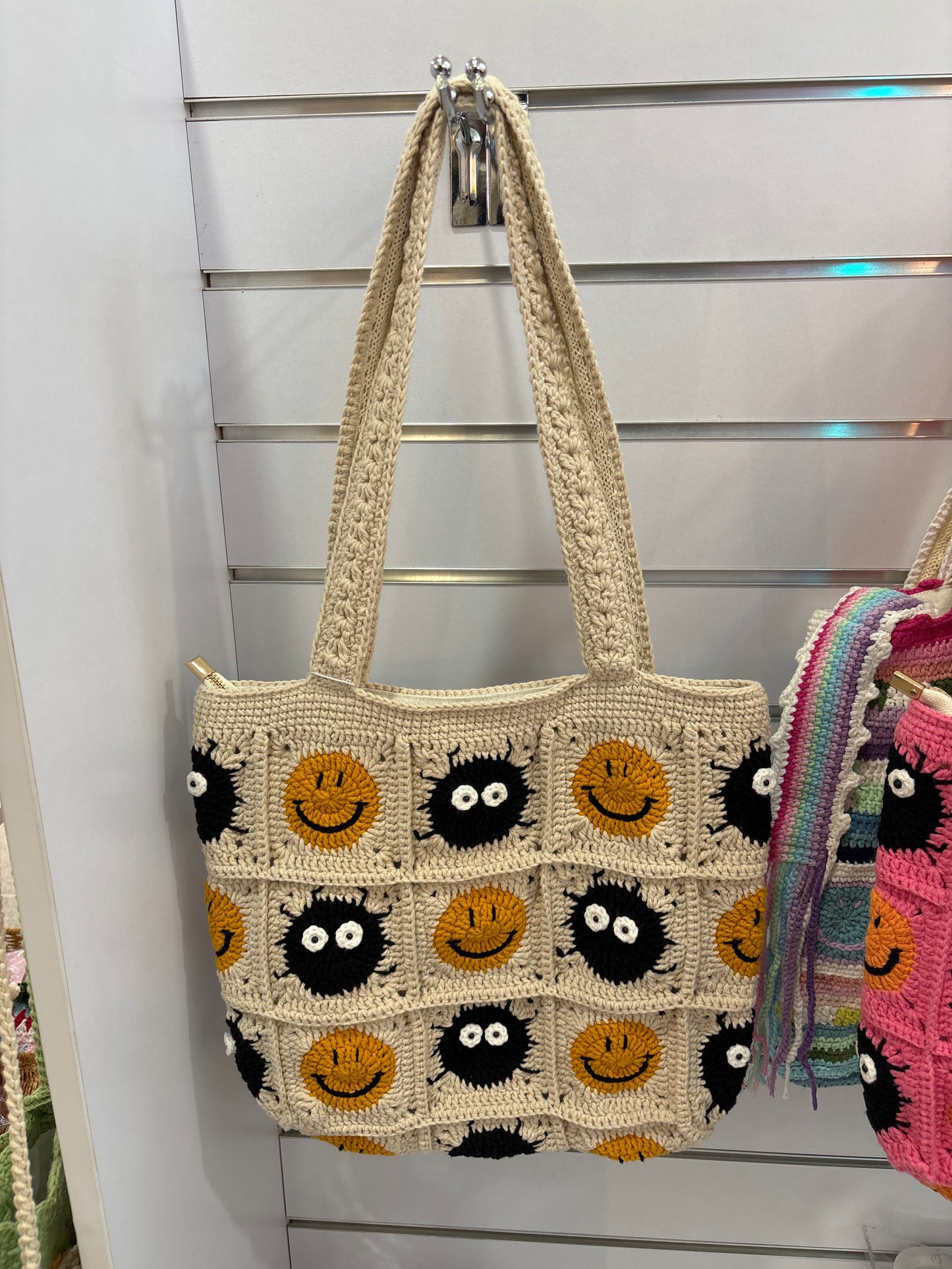 Handmade crochet bag with a charming smile pattern