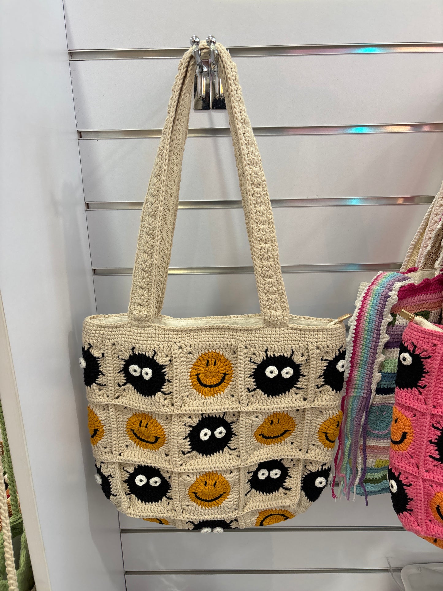 Handmade crochet bag with a charming smile pattern
