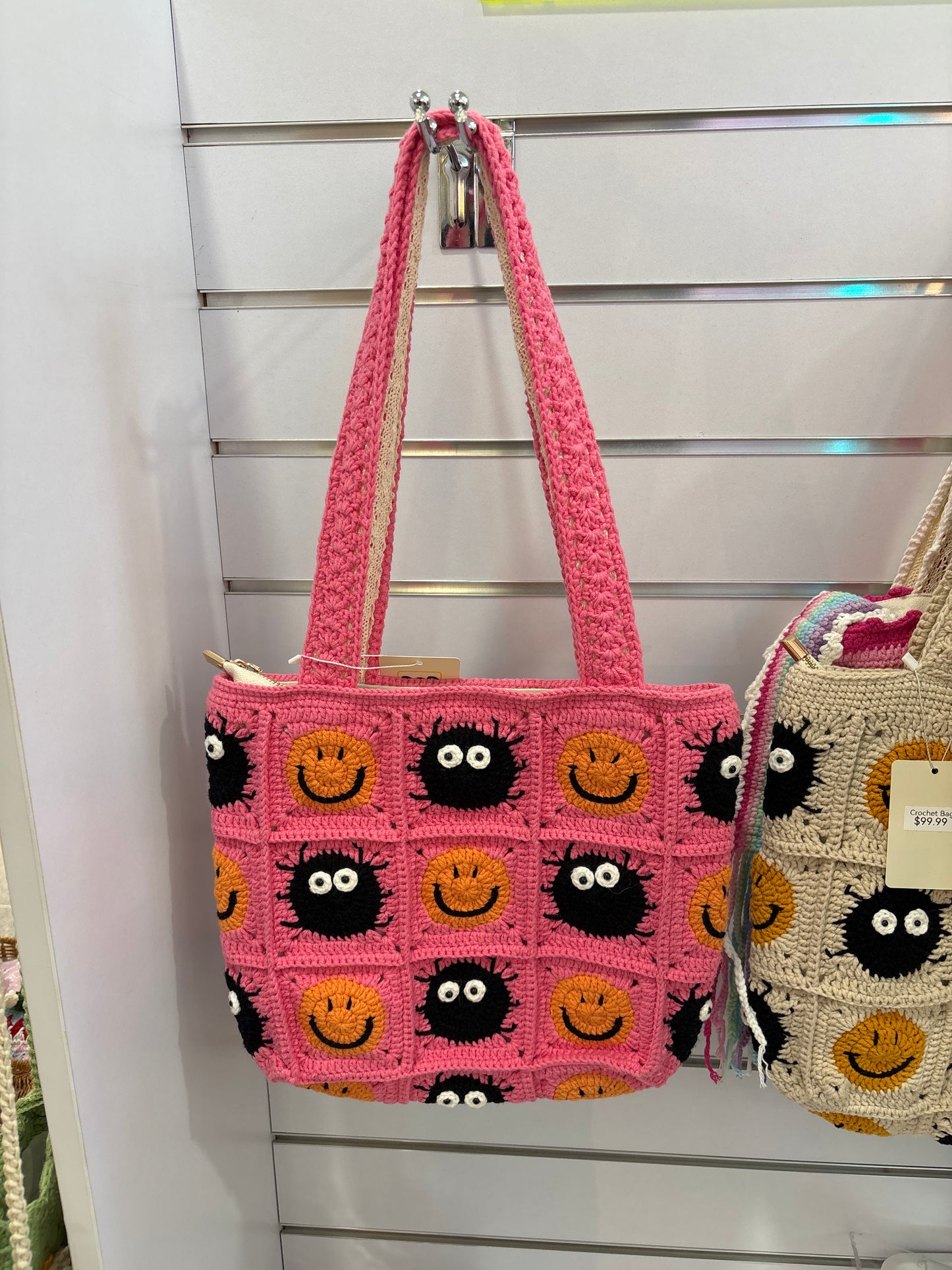 handmade crochet bag with a stylish smile face