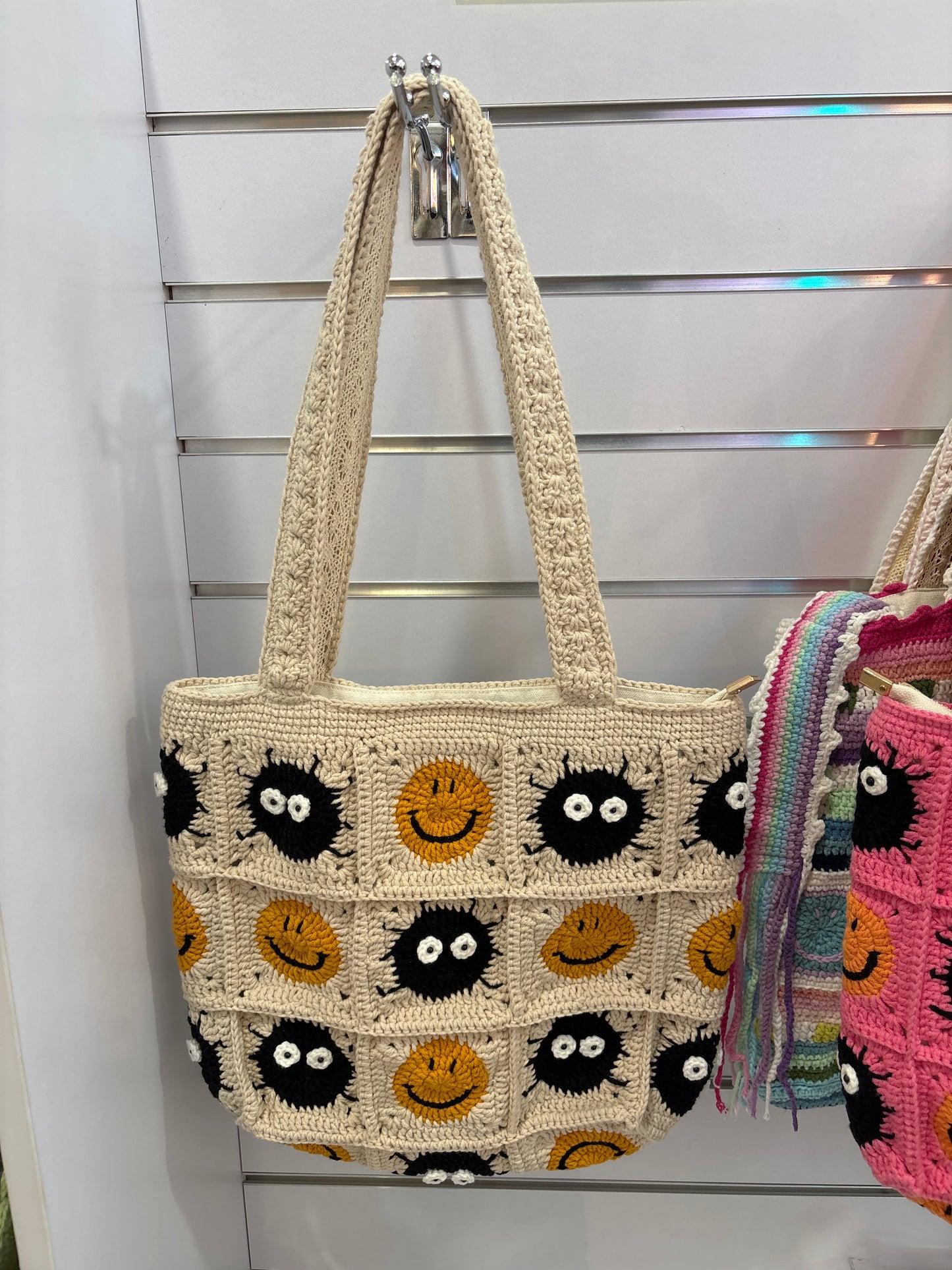 Handmade crochet bag with a charming smile pattern