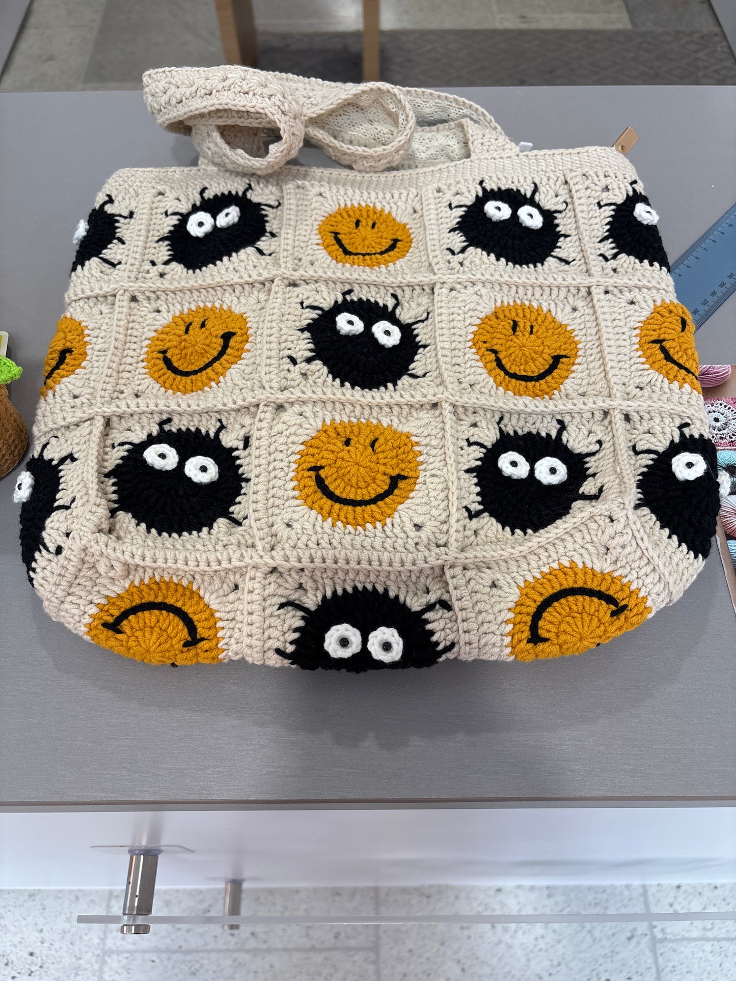 Handmade crochet bag with a charming smile pattern