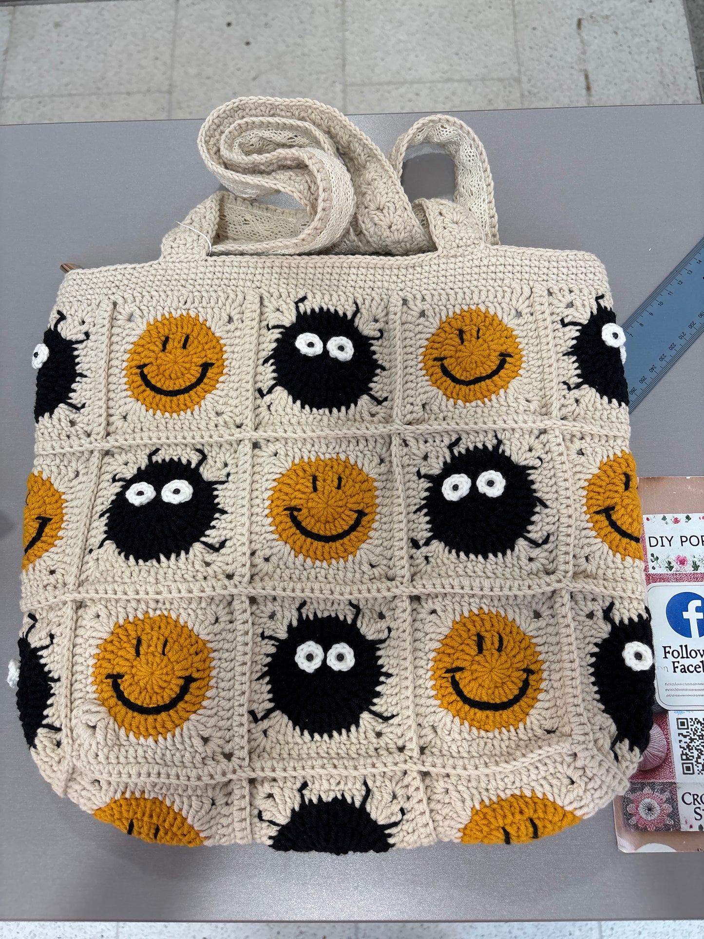 Handmade crochet bag with a charming smile pattern