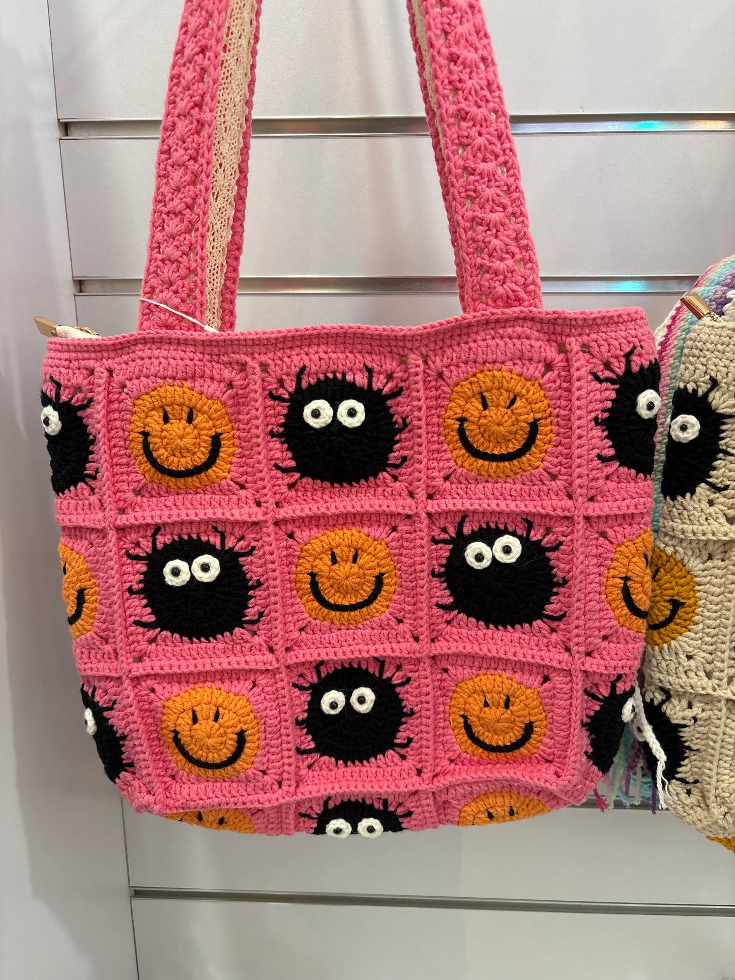handmade crochet bag with a stylish smile face