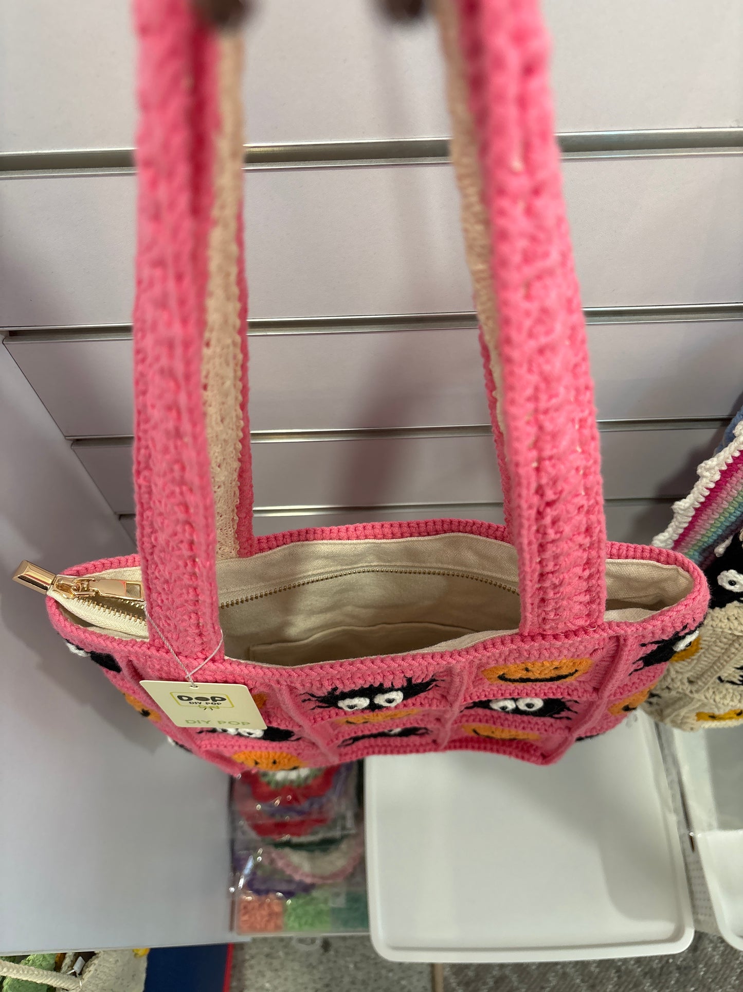 handmade crochet bag with a stylish smile face