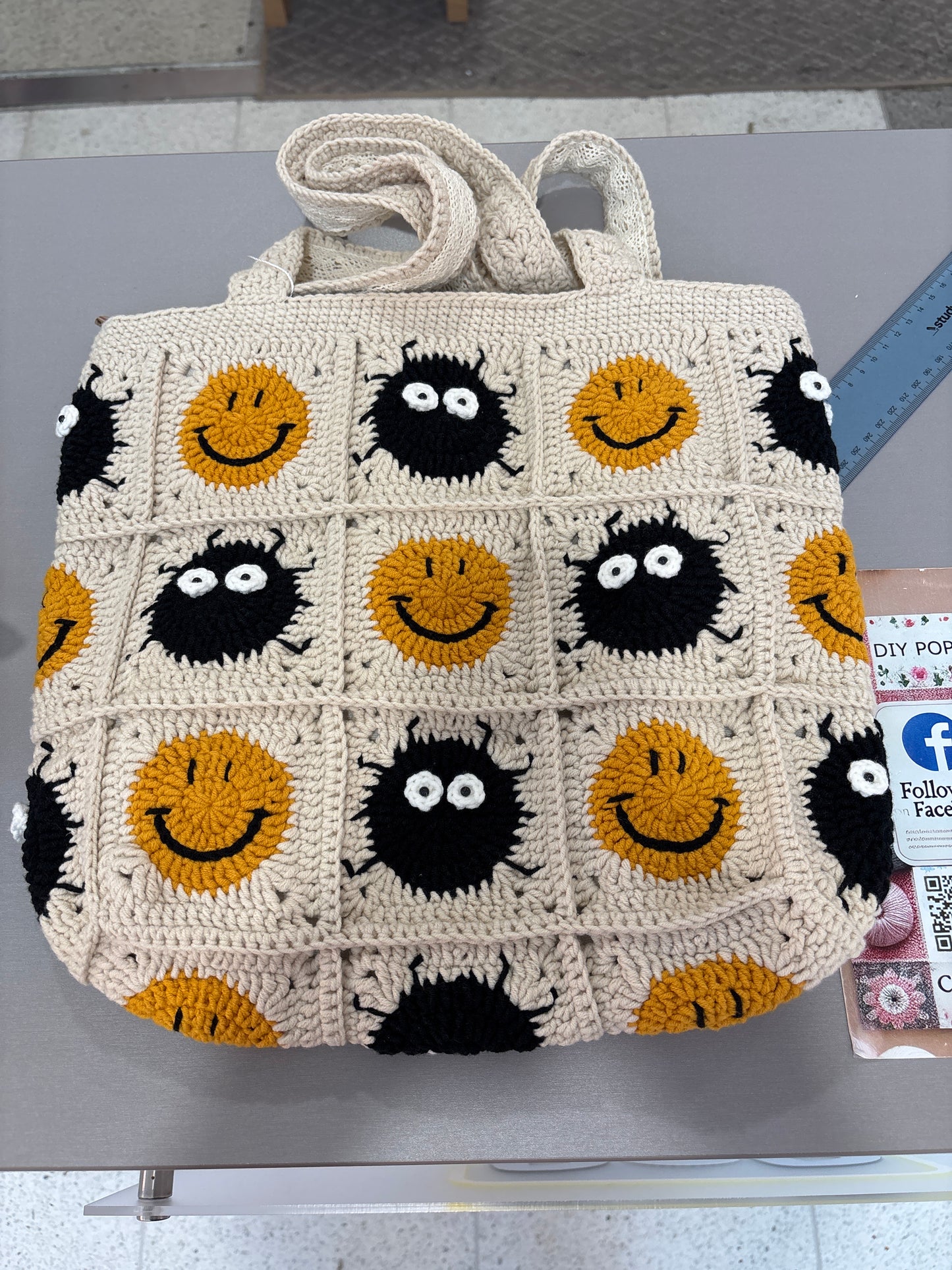 Handmade crochet bag with a charming smile pattern