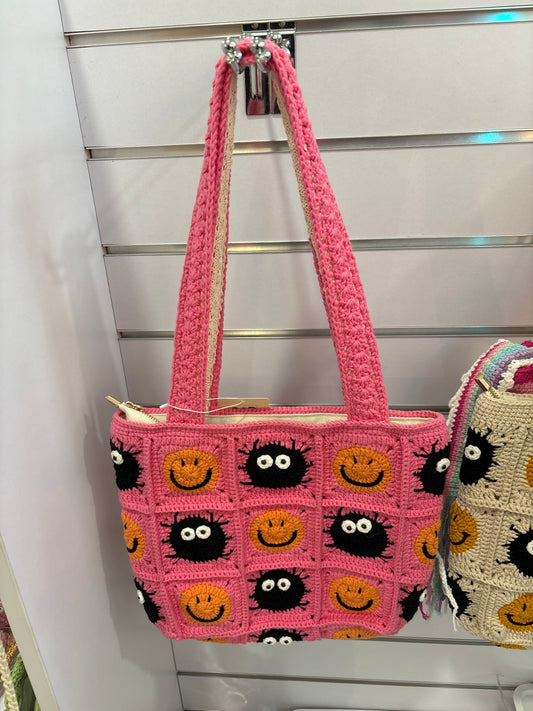 handmade crochet bag with a stylish smile face